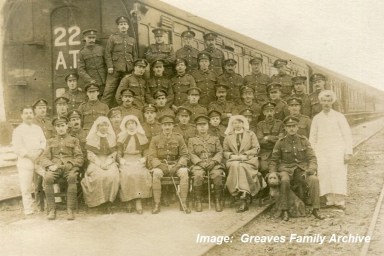 Staff Nurse Susan 'Susie' Greaves, nurse on left, with the staff of No 22 Ambulance Train, c1917-1918